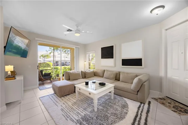 Tiled living room with ceiling fan