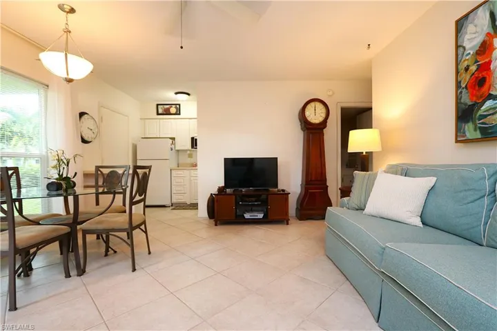 Living area with light tile patterned floors