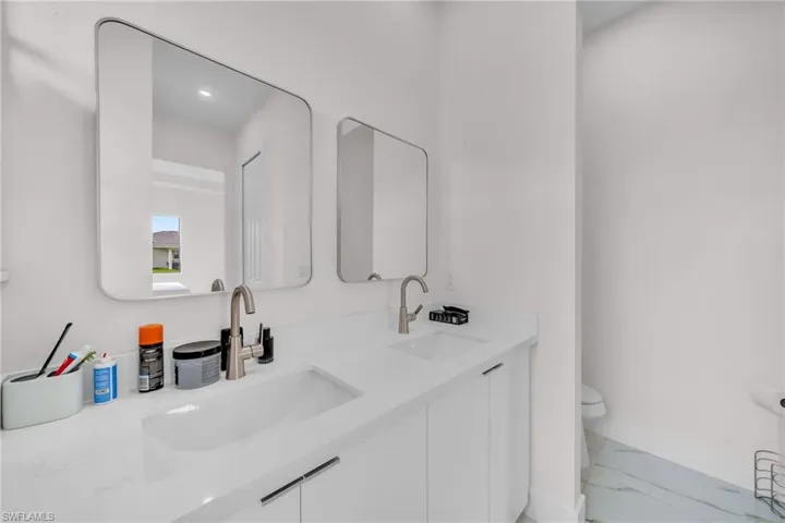 Bathroom featuring toilet and vanity