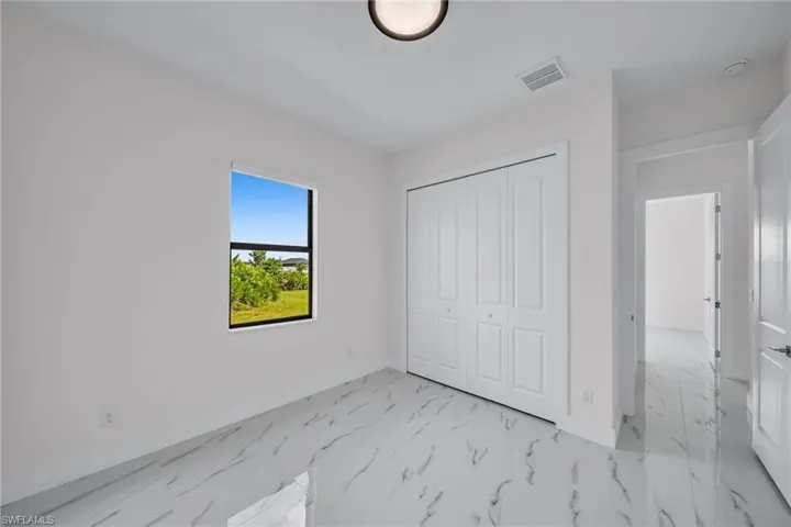 Unfurnished bedroom with a closet