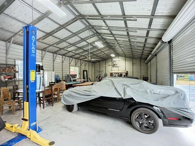 Garage featuring metal wall
