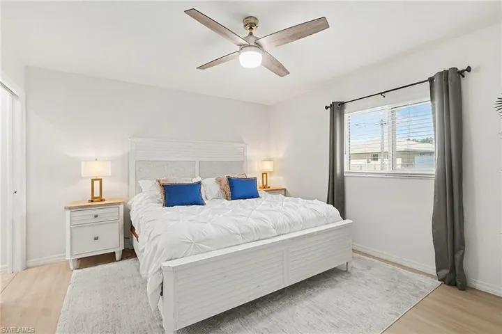 Bedroom featuring light wood-type flooring and ceiling fan