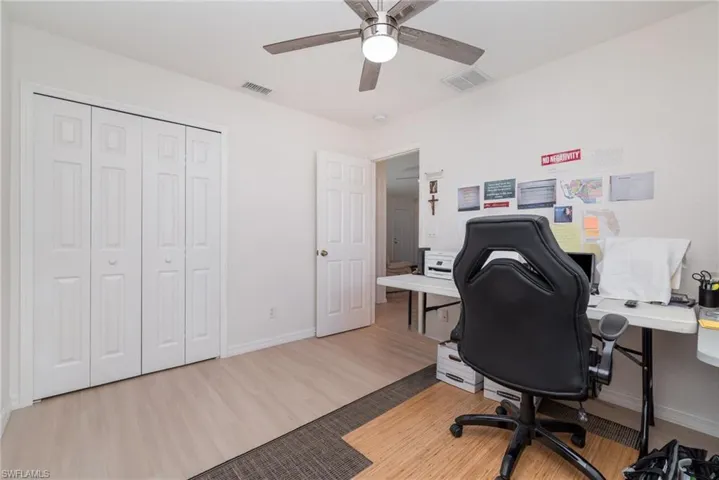 Office space featuring light wood-type flooring and ceiling fan