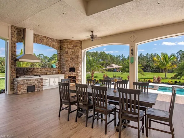 View of patio / terrace featuring ceiling fan and an outdoor kitchen
