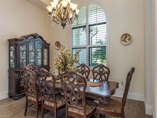 Dining area featuring a chandelier and hardwood / wood-style floors