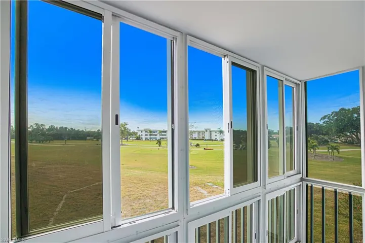 Unfurnished sunroom with view of golf course
