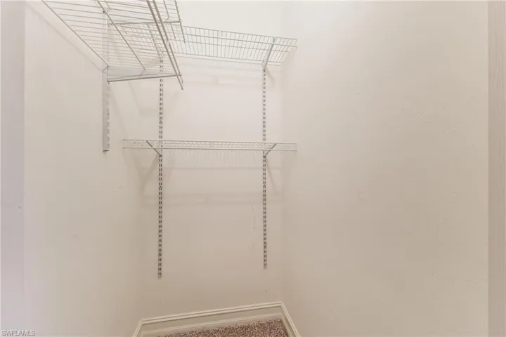 Built-in wire shelving system with white finish, providing adjustable storage options