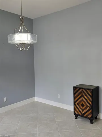 Spare room with light tile patterned flooring