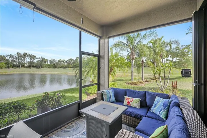 Sunroom featuring a water view