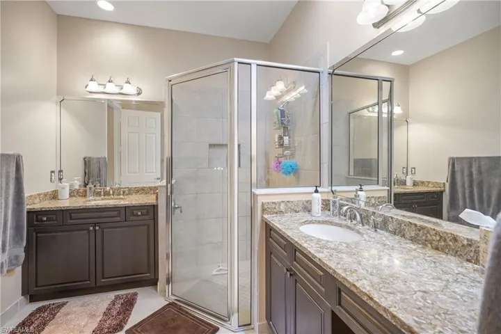 Bathroom featuring vanity and an enclosed shower