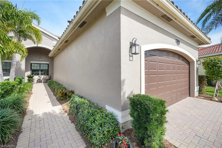 View of property exterior with a garage