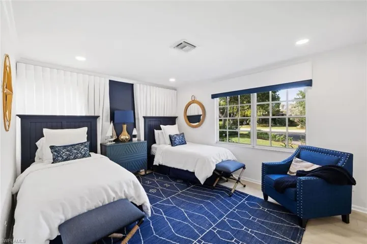 Bedroom with recessed lighting and wood finished floors