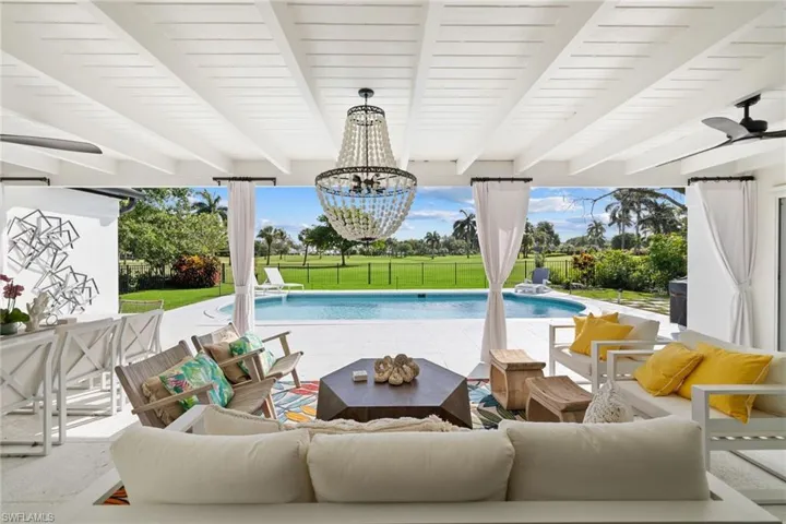 Swimming pool featuring outdoor lounge area, a patio area, and a fenced backyard