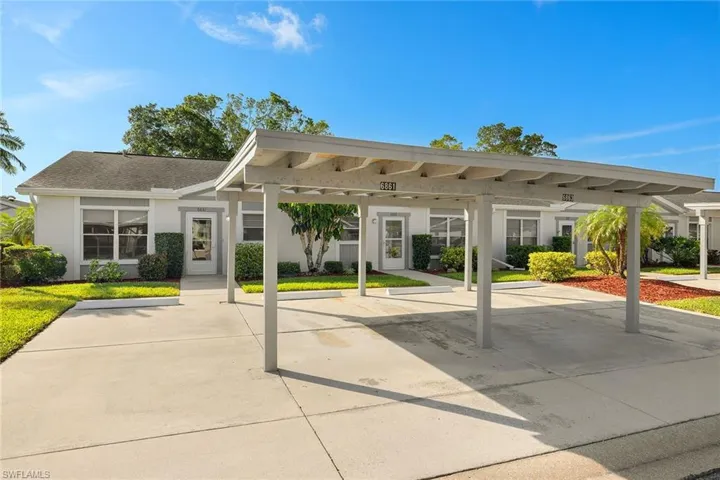 Front exterior with Assigned Carport