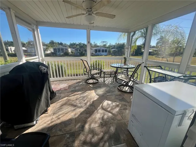 Sunroom with a ceiling fan and plenty of natural light