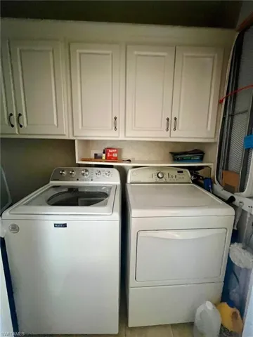 Washroom with independent washer and dryer and cabinet space