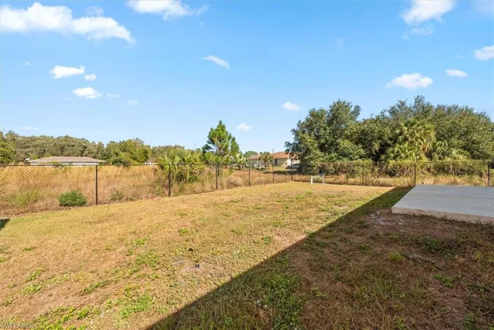 View of fenced backyard