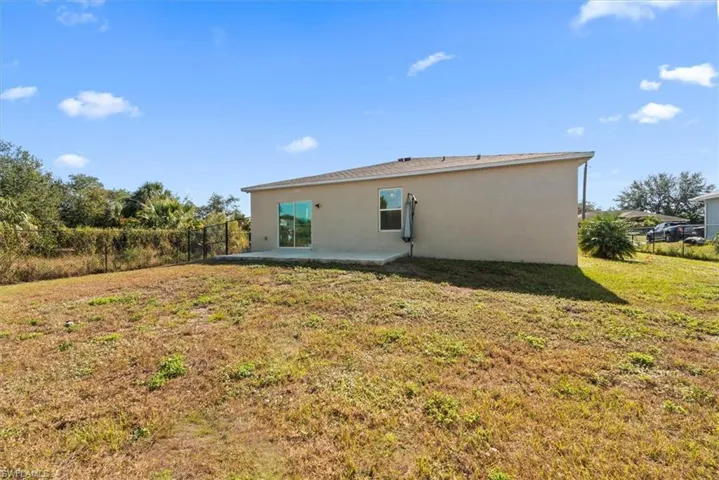 Rear view of house featuring a patio and stucco siding