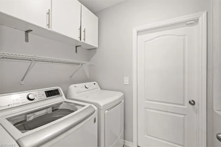 Laundry area with washing machine and dryer and cabinet space