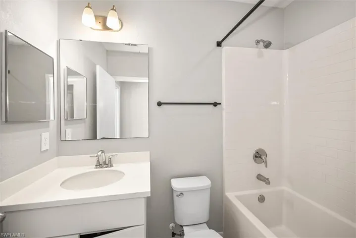 Full bath with vanity and bathtub / shower combination