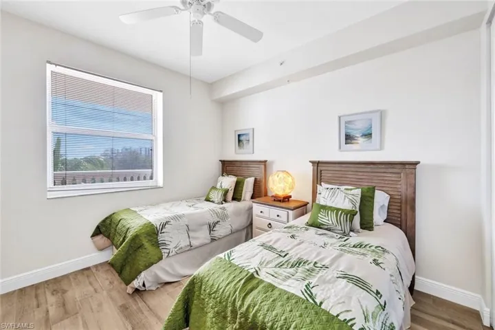 Bedroom featuring wood finished floors and ceiling fan