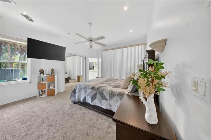 Spacious room with vaulted ceilings and recessed lighting