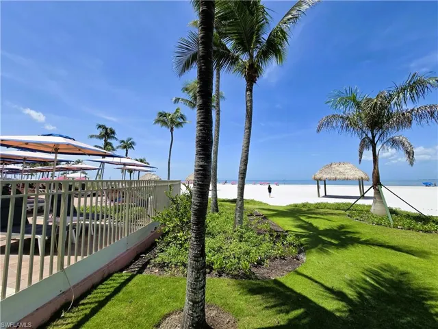 View of grassy yard with a water view