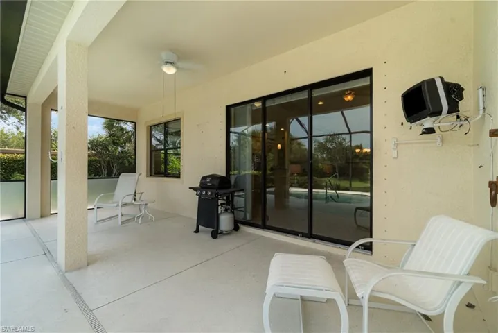 View of terrace featuring ceiling fan and area for grilling