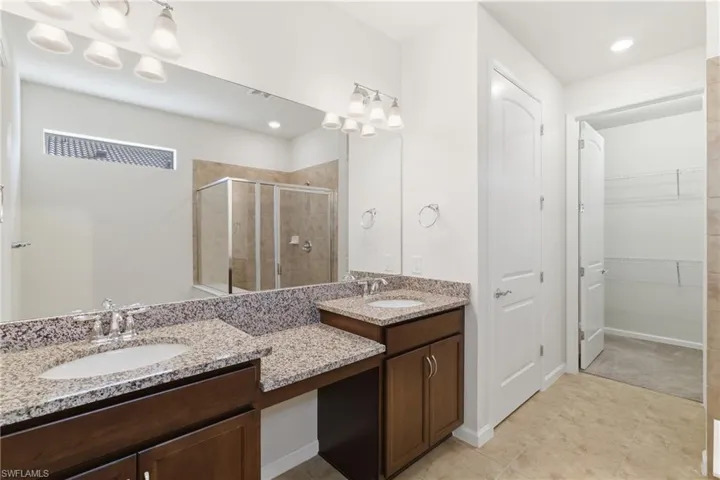 Primary bathroom with dual vanity sinks