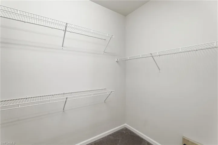 Walk in closet - primary bedroom