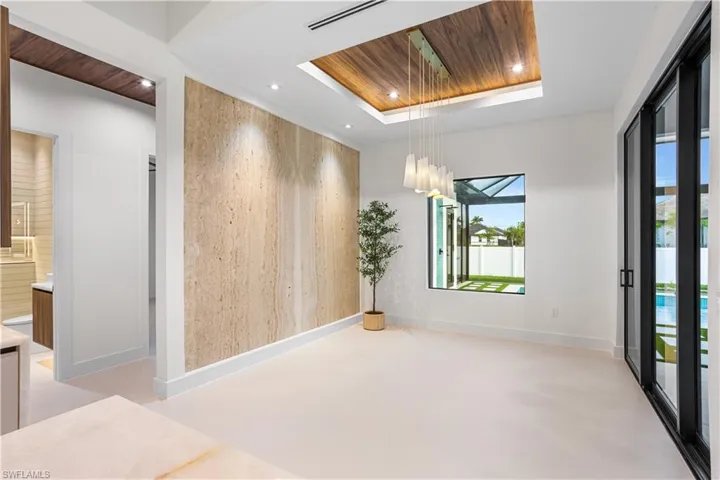 SOPHISTICATED FORMAL DINING ROOM w/ TRAVERTINE NATURAL STONE FEATURE WALL, FLAT WOODEN CEILING