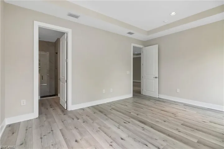 Unfurnished bedroom featuring light hardwood / wood-style flooring