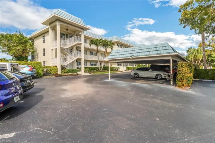Partially covered parking lot featuring stairs