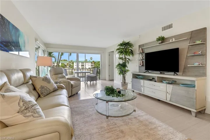 Living room featuring light tile patterned floors