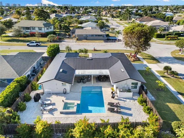 Aerial perspective of suburban area with a pool