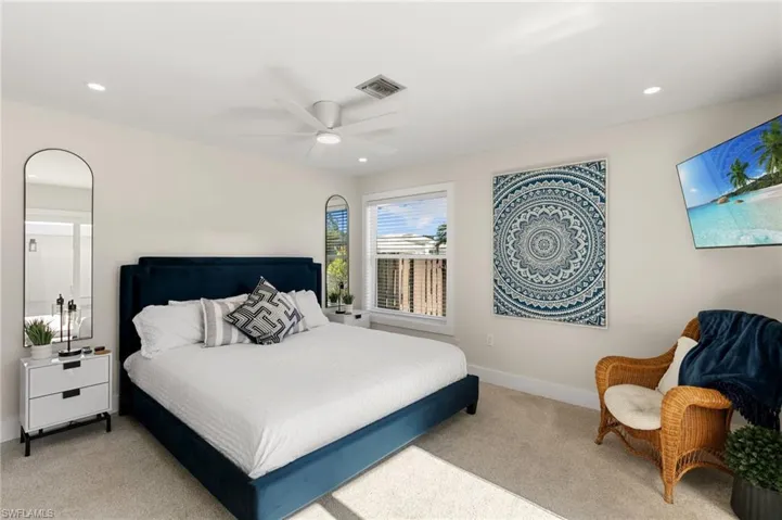 Bedroom with recessed lighting, light carpet, and a ceiling fan