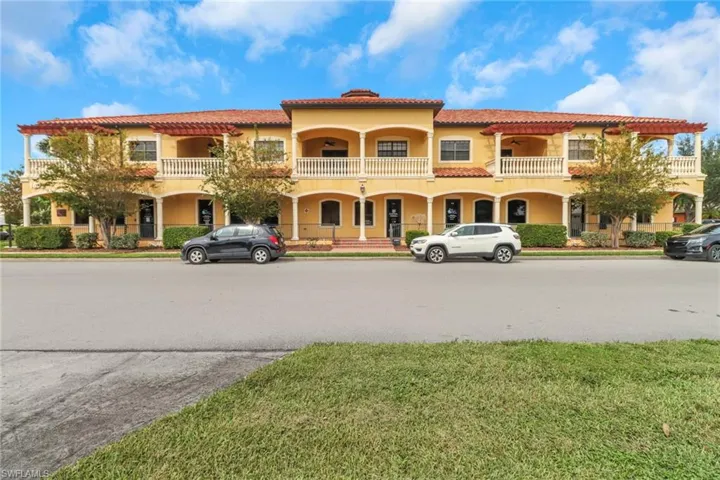 View of front of property with a porch and a balcony