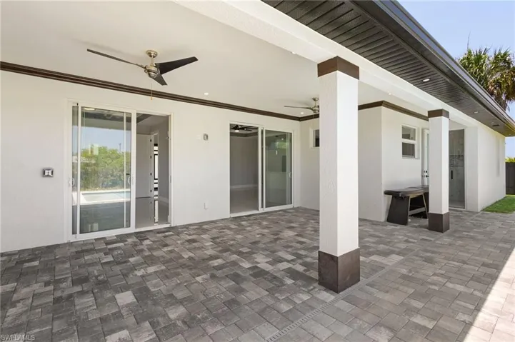 View of patio with ceiling fan