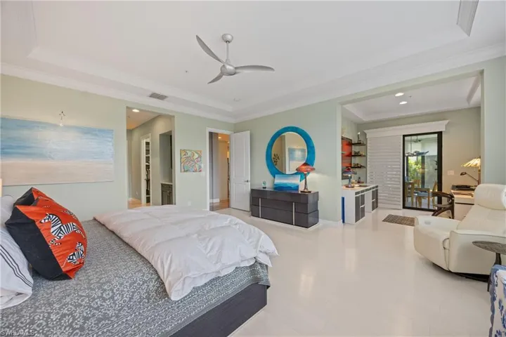 Bedroom featuring ornamental molding, recessed lighting, a raised ceiling, ceiling fan, and Maple wood finished floors