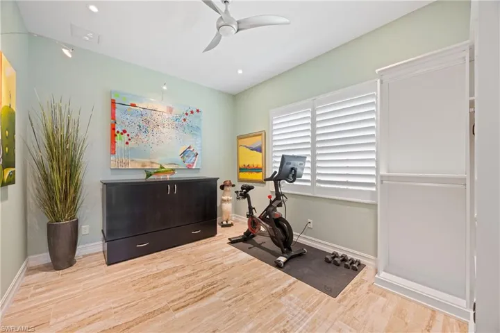 Den office with large format Porcelain Tile floors, a ceiling fan, and recessed lighting