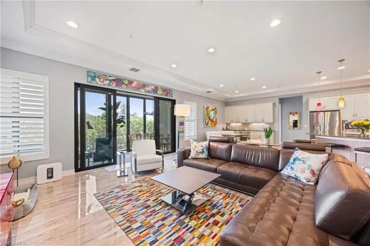 Living room featuring recessed lighting and crown molding