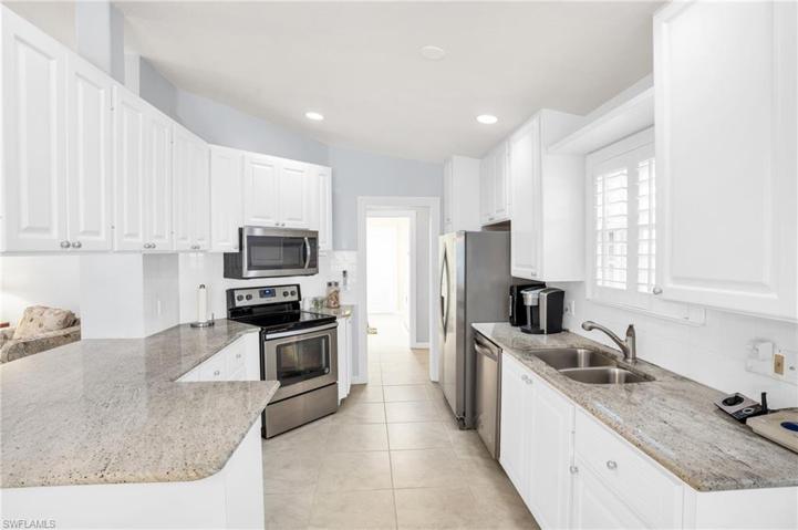 Granite counters & sunny kitchen window