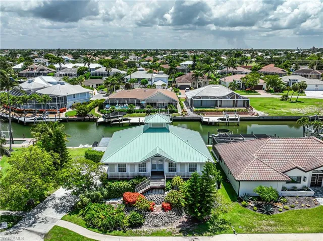 Aerial view of residential area featuring a large body of water