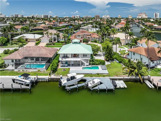 Aerial view of residential area with a large body of water