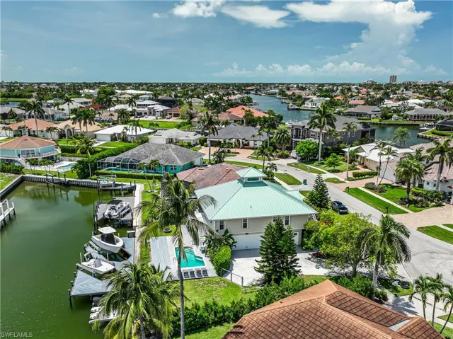 Aerial perspective of suburban area with a nearby body of water