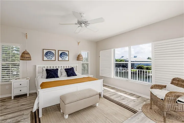 Bedroom featuring wood finished floors and a ceiling fan