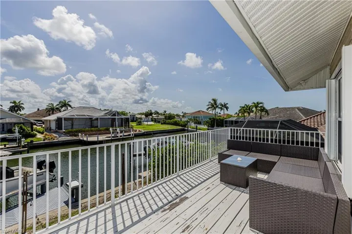Wooden deck with a water view and a residential view