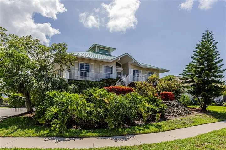 View of front of home with a porch and a metal roof