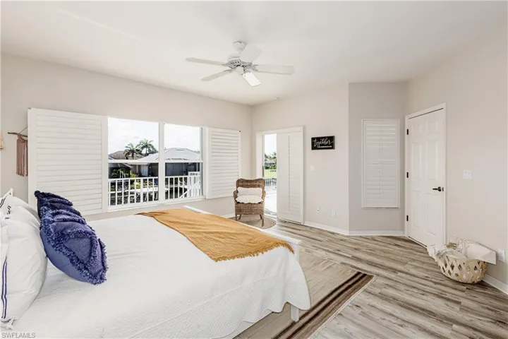 Bedroom with wood finished floors and ceiling fan