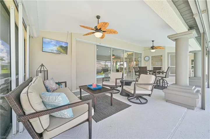 Sunroom featuring decorative columns and ceiling fan